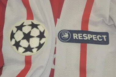 11-12 Arsenal home UCL fonts