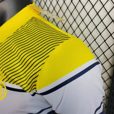 Polo amarillo del Al-Nassr de Arabia Saudí, 23-24
